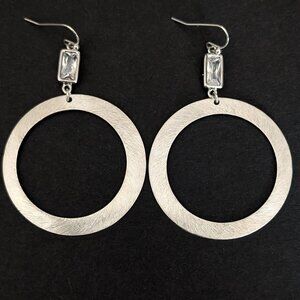 Brushed silver tone drop hoop earrings with clear bead accents